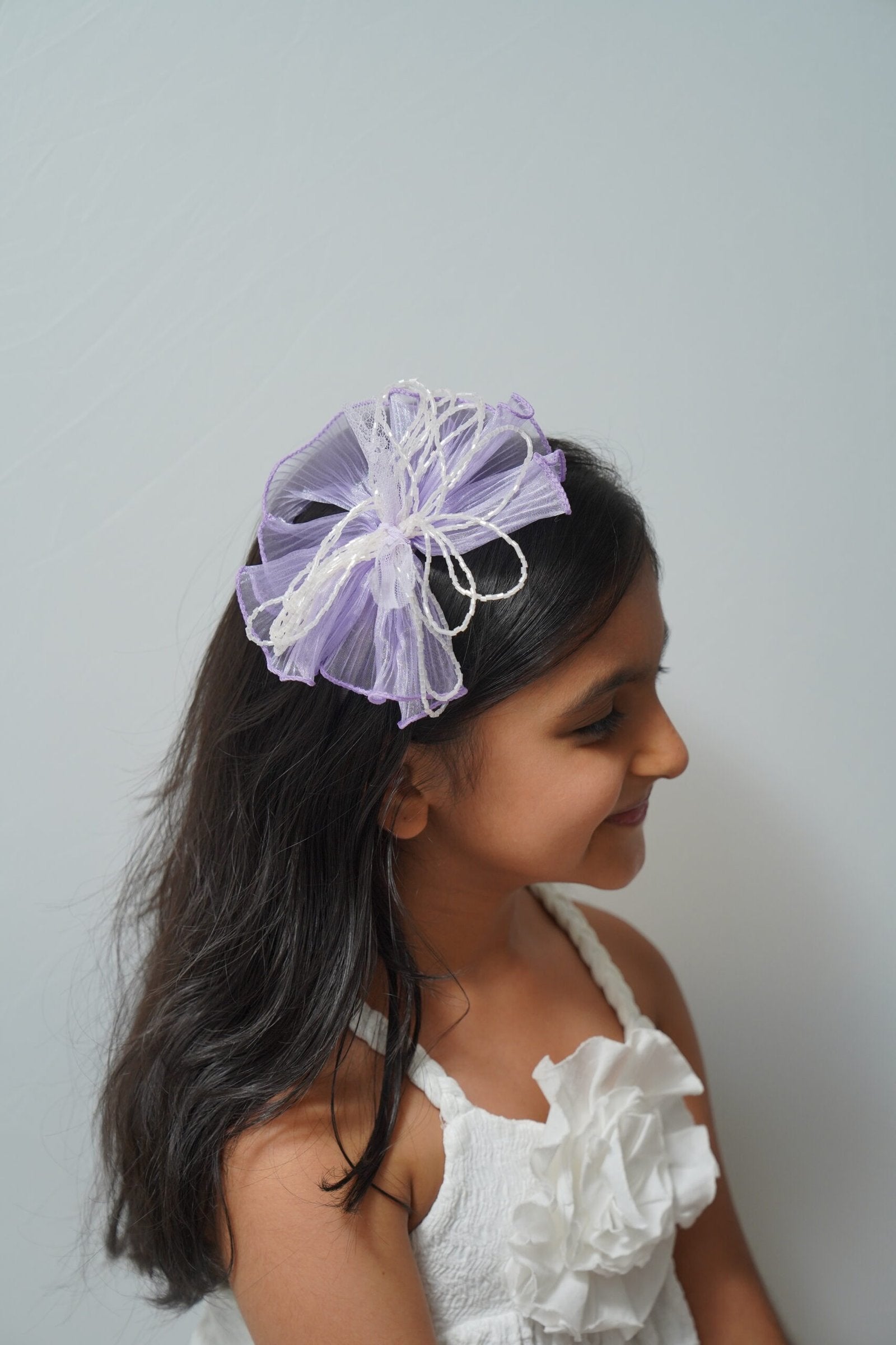 Mesh flower with beaded bows