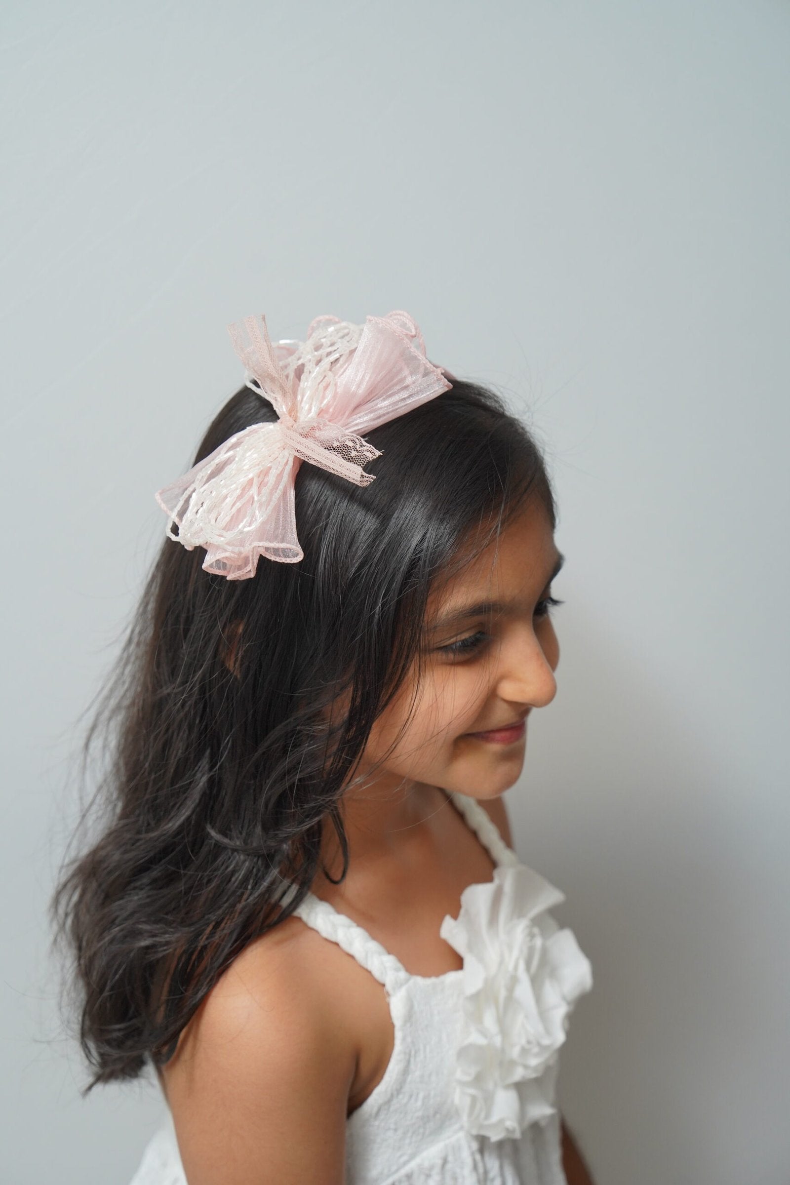 Mesh flower with beaded bows