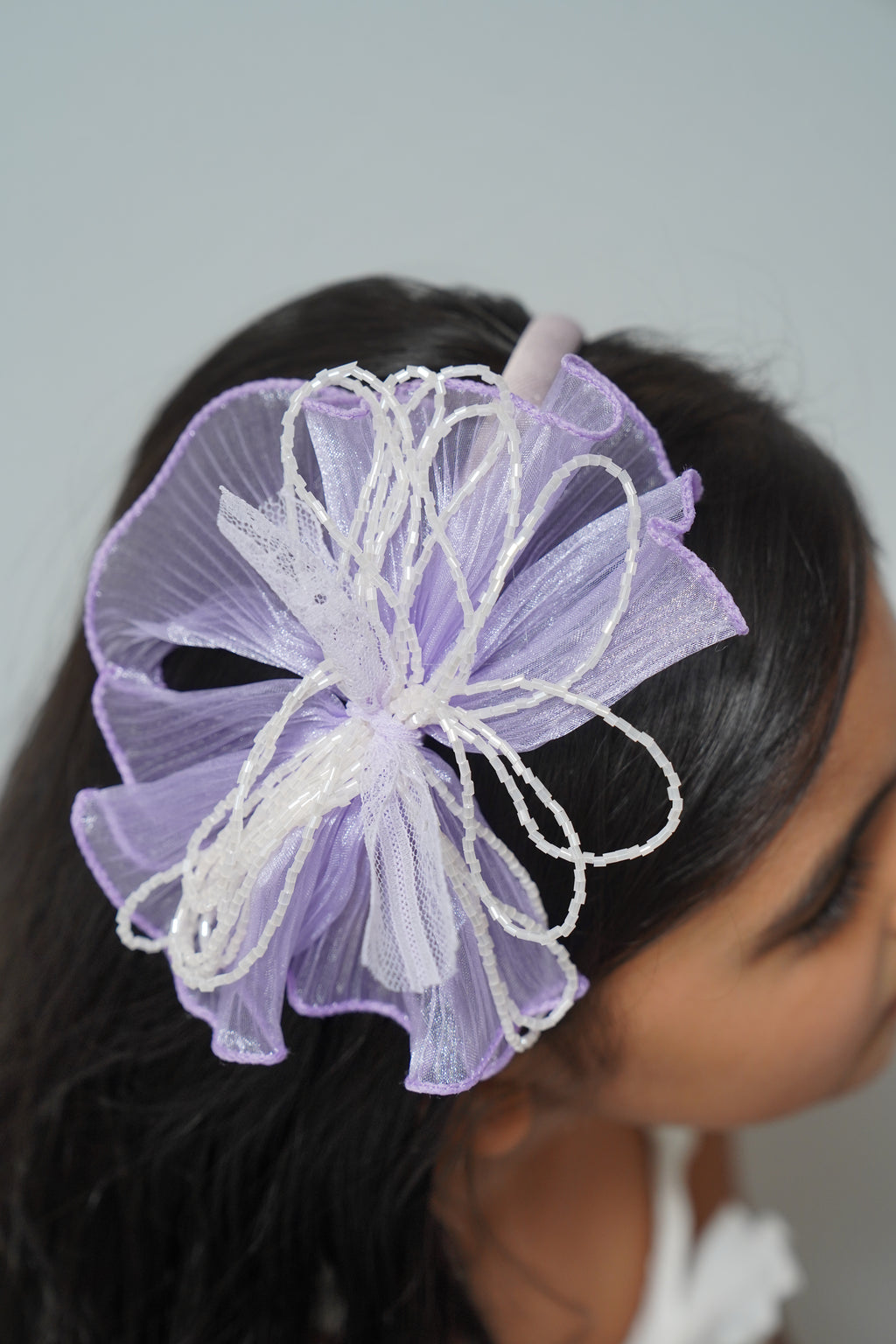 Mesh flower with beaded bows