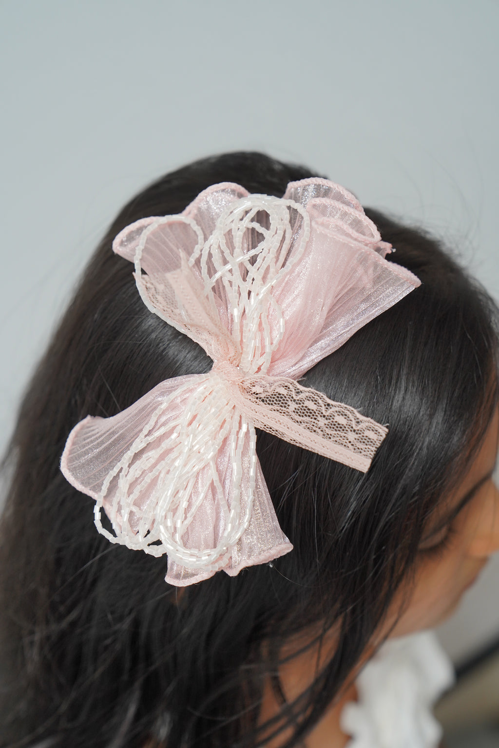 Mesh flower with beaded bows