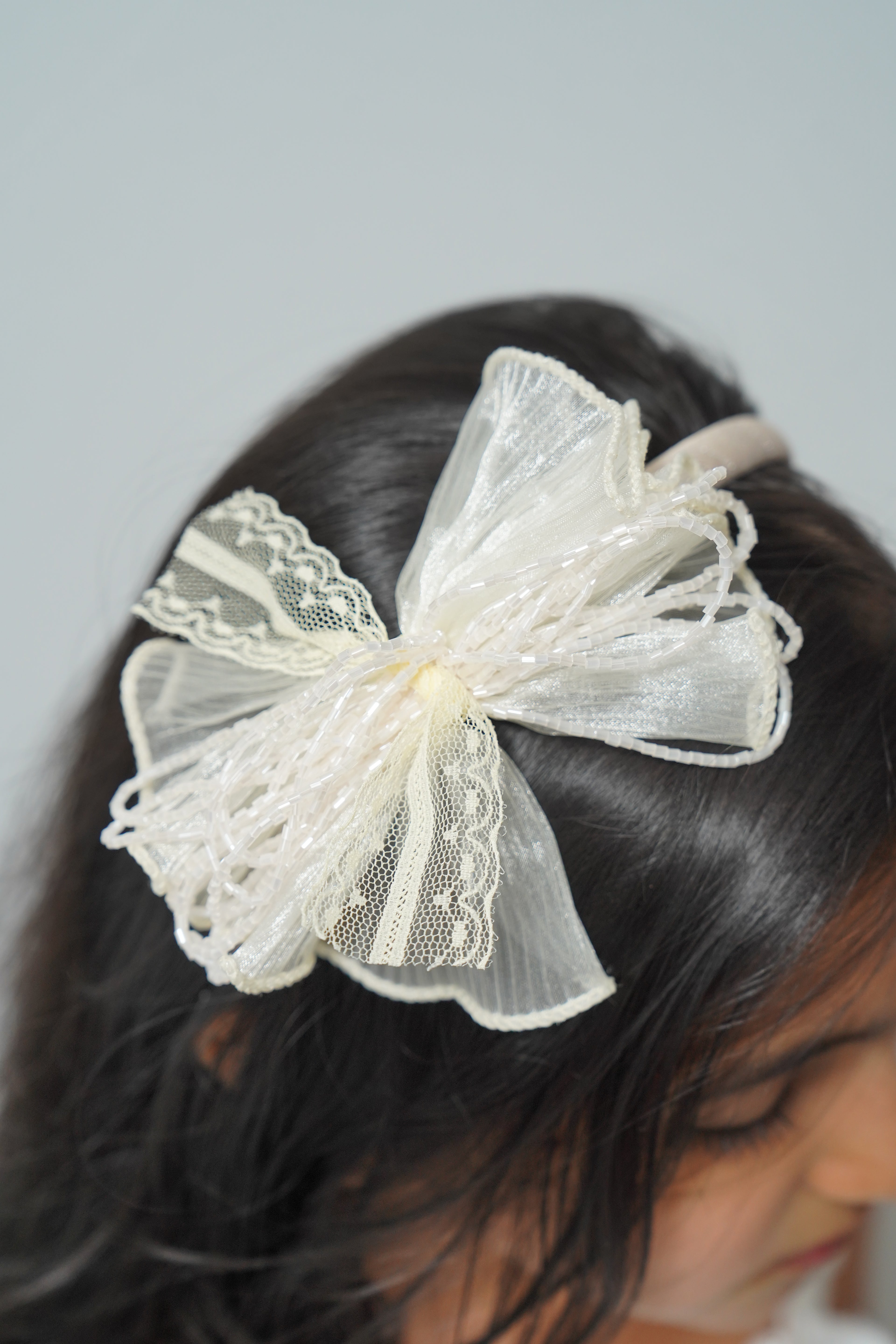 Mesh flower with beaded bows